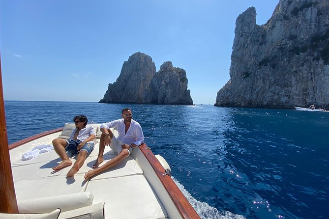 Capri Boat Tour: Grottoes, Swim & Sip Limoncello in a Small Group - The Faraglioni Loop and the Arch of Love: When the Sea Show Gets Real