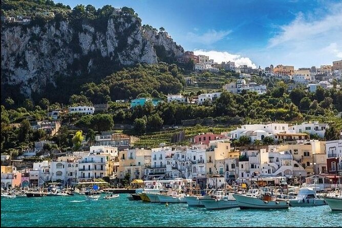 Capri Deluxe/First to Blue Grotto/from Sorrento Positano & Amalfi - Stop 5: Piazzetta di Capri, the classic square with shops and café energy