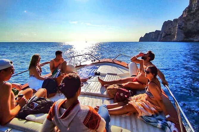 Capri Guided Boat Experience with Island Exploration and Transfer - Faraglioni Rocks and the eastern natural arch, your best photo sequence
