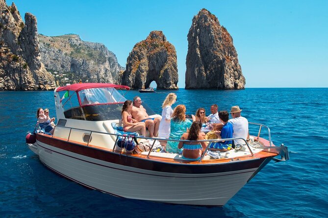 Capri Guided Boat Experience with Island Exploration and Transfer - Punta Carena lighthouse, history on the boat and classic coastal views
