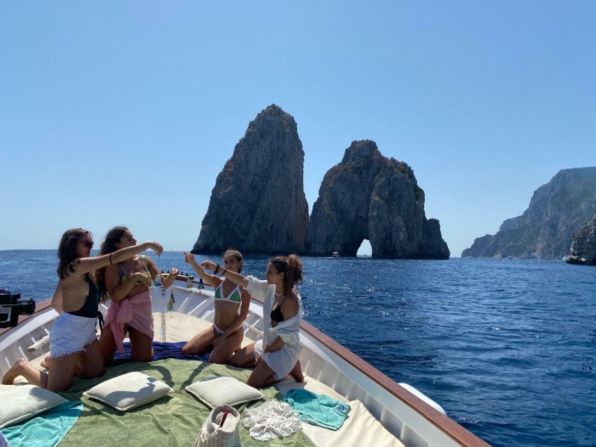 Capri: Island and Grottos Boat Cruise with Snacks and Drinks - Limoncello, snacks, and the easy onboard pace