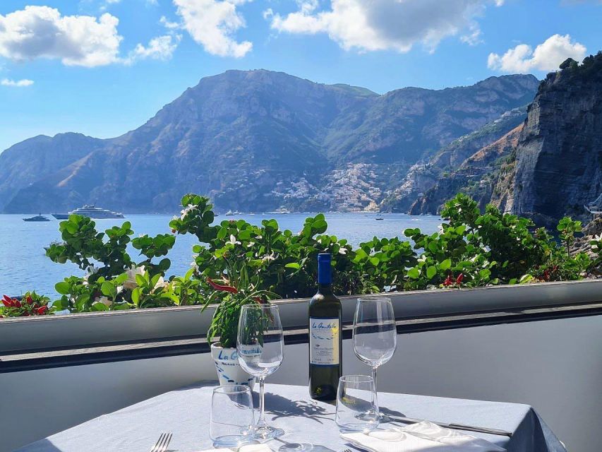 From Amalfi: 7H Amalfi Coast - Group Tour by boat - Conca dei Marini, the Natural Arch, and big-photo moments
