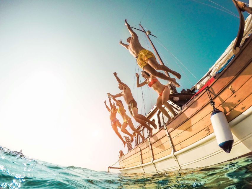 From Amalfi: Capri Island Boat Tour with Snorkeling & Drinks - Meeting at Darsena pier in Amalfi, and boarding the gozzo