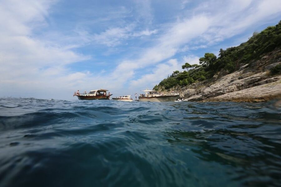 From Sorrento: Full-Day Boat Cruise to Capri - Faraglioni sea stacks and Punta Carena Lighthouse, seen from the right angle