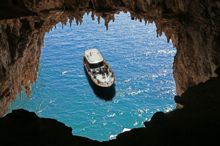 From Sorrento: Full-Day Boat Cruise to Capri - The boat ride across the Tyrrhenian Sea, snacks, and skipper storytelling