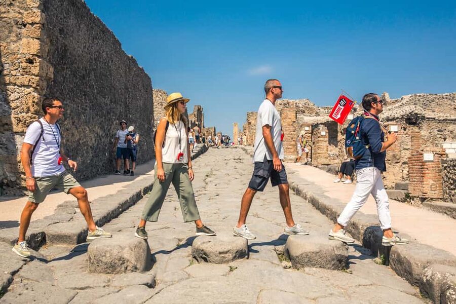 From Sorrento: Pompeii Half-Day Skip-the-Line Tour - What you see inside Pompeii, from villas and baths to an amphitheater