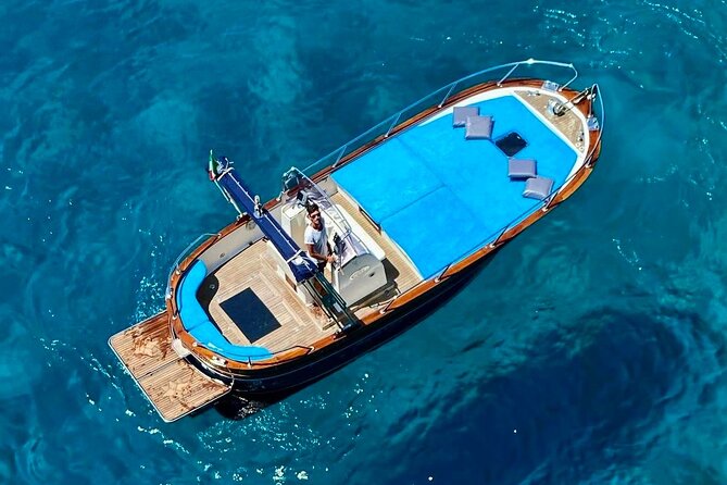 Half day tour of Capri by private boat - I Faraglioni close pass: the arch photo and why sea level matters