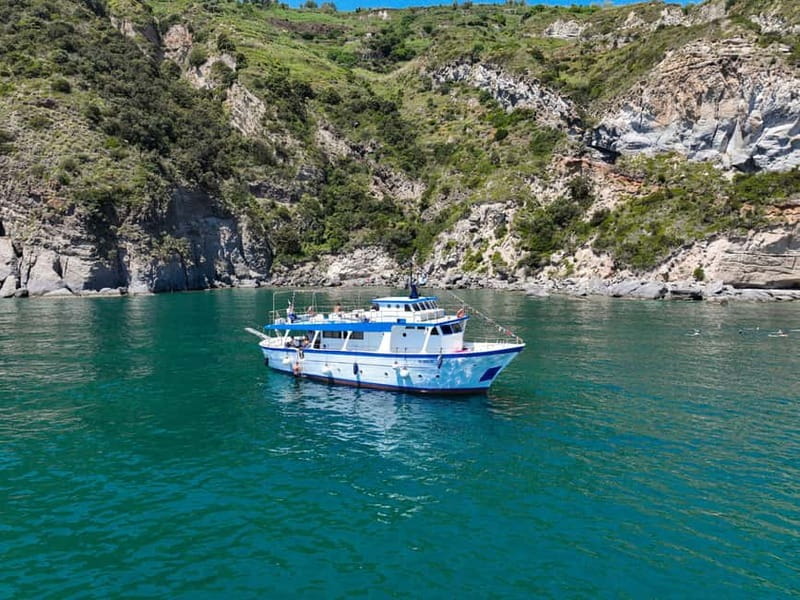 Ischia: Boat tour with swimming stops and lunch on board - Meeting in Forio, then cruising with coffee and a plan
