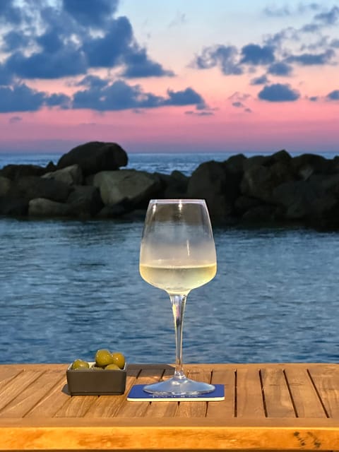 Italian aperitif at the sunset by the sea - Quick hits before you go