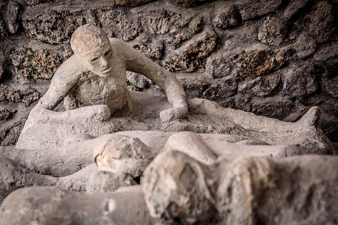 PompeiI Exclusive Tour with your Archaeologist in a Small Group - The Forum core: Basilica, Main Square, and the Temple of Jupiter with Vesuvius in view