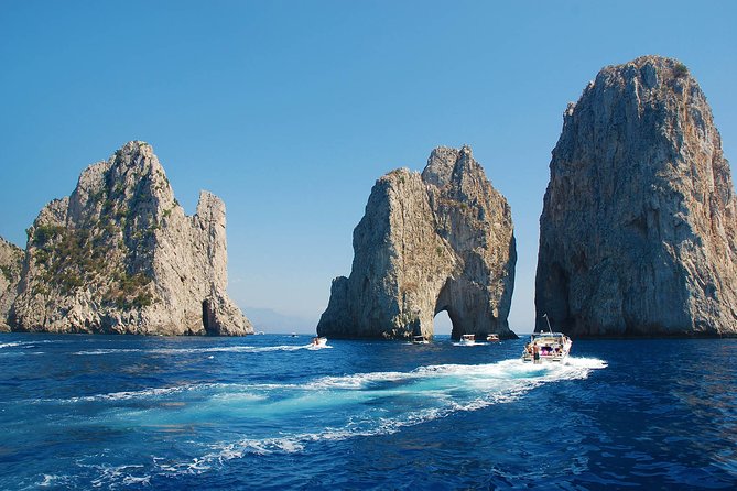 Small Group Boat Tour Capri & Blue Grotto with Swimming Stops - Landmark photo moments: Natural Arch, Casa Malaparte, Faraglioni, and Punta Carena