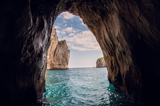 Small Group Capri Island Boat Ride with Swimming and Limoncello - Meeting Marina Grande: finding your boat under the white umbrellas